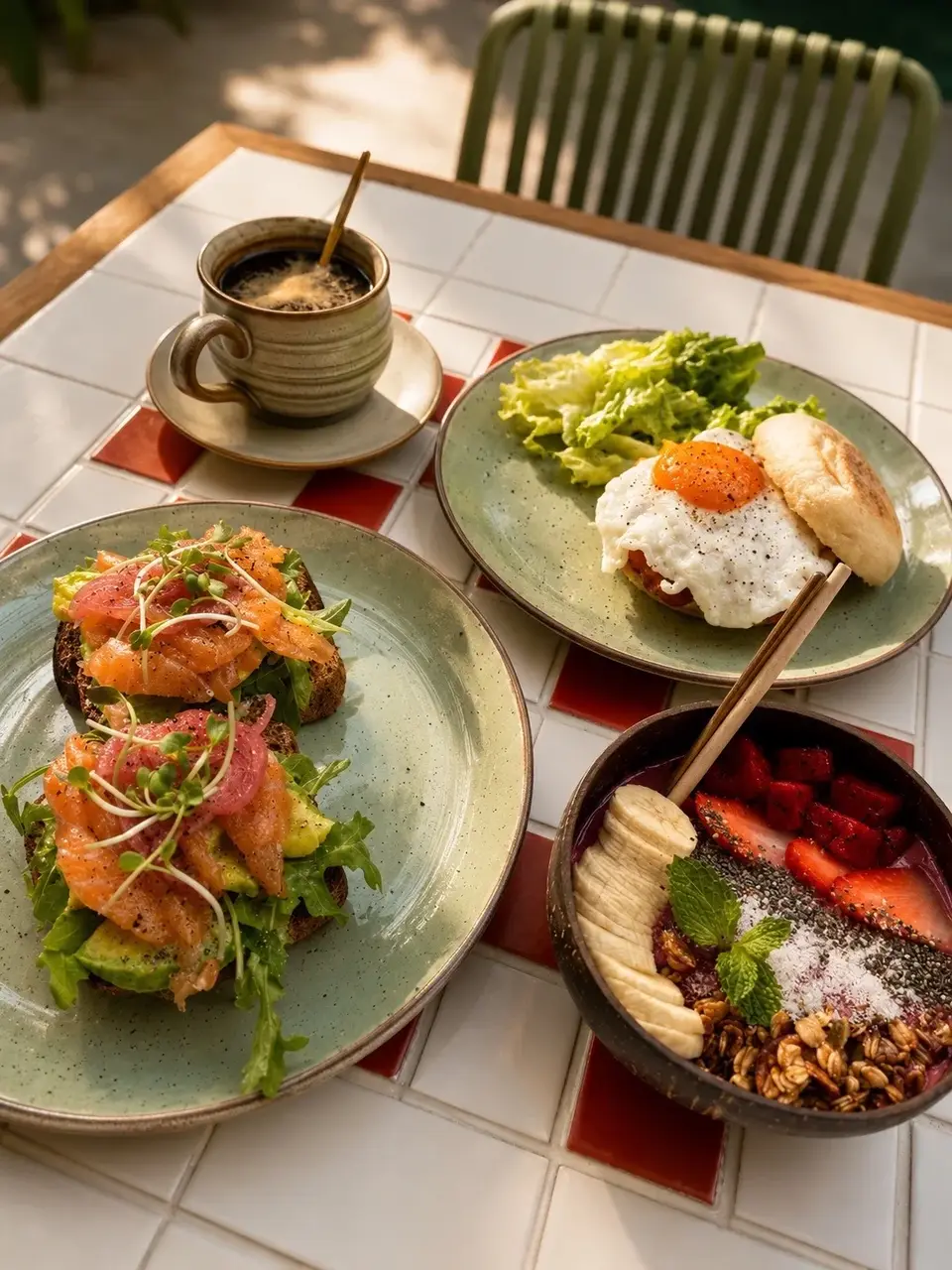 Brunch plates and coffee on a table at Au Patio Thảo Điền