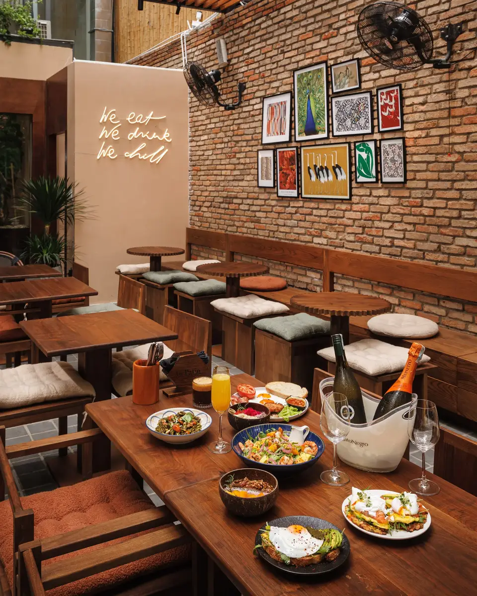 District 1 dining room with wooden tables and framed artwork