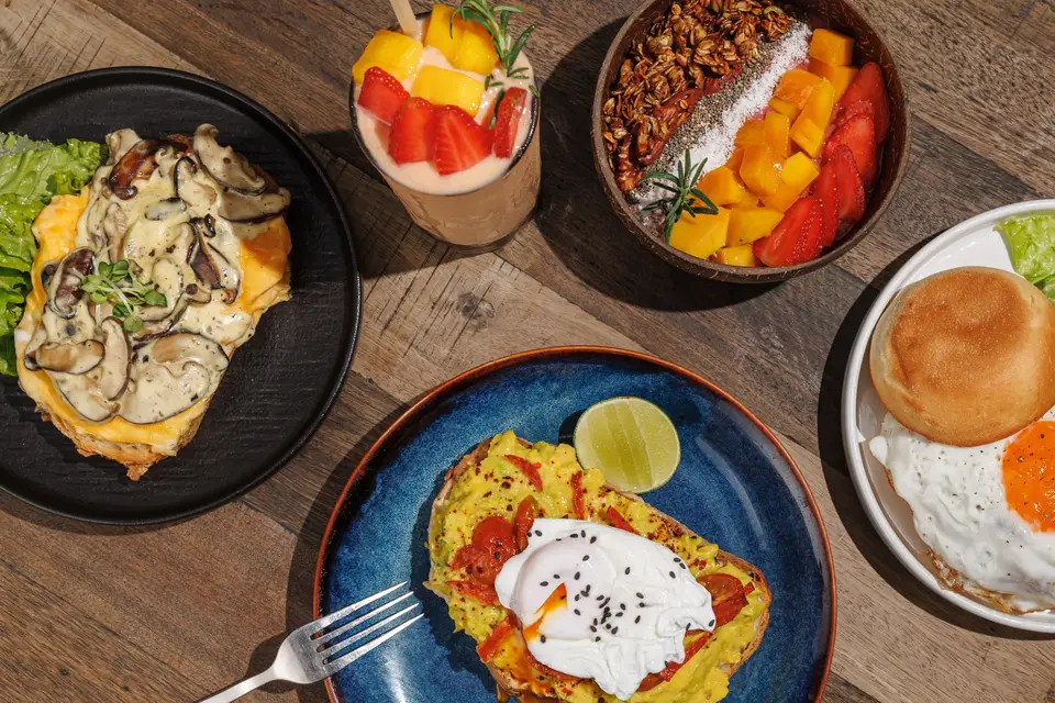 Overhead view of brunch plates and fruit